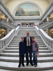 Andrew Edtl with Children at the Utah State Capitol Andrew Edtl standing with two of his children on the stairs of the Utah State Capitol.