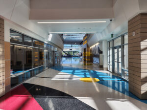 Mount Jordan Middle School Modern Hallway Interior hallway at Mount Jordan Middle School featuring modern design elements, polished floors, natural light, and updated architectural finishes.